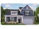 Charming two-story home featuring stone accents, a covered porch, and a two-car garage, nestled in a beautifully landscaped community at 7568 Percussion Dr, Apex, NC 27539