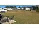 Expansive backyard with a patio seating area, a vast lawn, and serene views of the neighborhood at 768 Riguard Way, Wendell, NC 27591