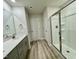 Full bathroom with shower, white cabinets, and modern fixtures at 768 Riguard Way, Wendell, NC 27591