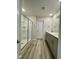 Bathroom featuring double sinks, walk-in shower and modern finishes at 768 Riguard Way, Wendell, NC 27591