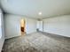 Bright bedroom with carpeted floor and two doors leading to adjoining spaces at 768 Riguard Way, Wendell, NC 27591