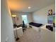 Cozy bedroom with carpet, a desk area, and natural light creating a relaxing atmosphere at 768 Riguard Way, Wendell, NC 27591