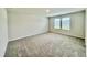 Bedroom with carpeted floor, two windows providing ample natural light at 768 Riguard Way, Wendell, NC 27591