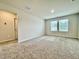 Carpeted bedroom with bright natural light from the two windows at 768 Riguard Way, Wendell, NC 27591