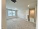 Loft area featuring carpeted floors, bright windows, and recessed lighting at 768 Riguard Way, Wendell, NC 27591