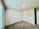 Cozy bedroom with neutral carpet and two white doors at 768 Riguard Way, Wendell, NC 27591