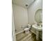 Chic half bathroom featuring stylish fixtures and a pedestal sink, ideal for guests at 768 Riguard Way, Wendell, NC 27591