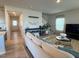 Bright living room featuring a couch and neutral color palette with a staircase to the side at 768 Riguard Way, Wendell, NC 27591