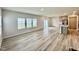 Spacious living area featuring wood-look flooring and a slider to the back, connecting indoor/outdoor living at 768 Riguard Way, Wendell, NC 27591
