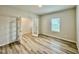 Well-lit office featuring wood-look floors and stylish glass paneled double doors at 768 Riguard Way, Wendell, NC 27591