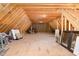 Unfinished attic area with exposed beams, subfloor, and large space at 7936 Nc 42, Holly Springs, NC 27540