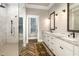 Luxurious bathroom features double vanities, granite countertops, and walk-in shower at 7936 Nc 42, Holly Springs, NC 27540