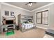 Comfortable bedroom with a bunk bed, desk, and natural light at 7936 Nc 42, Holly Springs, NC 27540