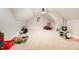 Large bonus room featuring carpet, ceiling fan, and natural light at 7936 Nc 42, Holly Springs, NC 27540