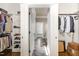 Walk-in closet with custom shelving for optimal storage and organization at 7936 Nc 42, Holly Springs, NC 27540