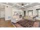 Spacious living room with an elegant ceiling, hard wood floors, and natural light at 7936 Nc 42, Holly Springs, NC 27540