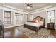 Spacious main bedroom with hardwood floors and balcony access at 7936 Nc 42, Holly Springs, NC 27540