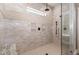 Modern shower with decorative tile, overhead fixture and bench at 7936 Nc 42, Holly Springs, NC 27540