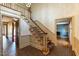 Grand foyer with a staircase and hardwood floors, offering a classic design at 8700 Hebron Church Rd, Mebane, NC 27302