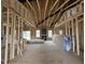 Spacious living room featuring exposed beams, and large windows for natural light at 880 Olive Branch Dr, Smithfield, NC 27577
