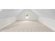 Finished attic space featuring neutral carpet and a window that fills room with natural light at 9173 Dupree Meadow Ct # 25, Angier, NC 27501