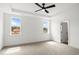 A light and airy bedroom with two windows and neutral carpeting at 9173 Dupree Meadow Ct # 25, Angier, NC 27501