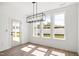 Sunny dining room with modern lighting and access to outdoor space at 9173 Dupree Meadow Ct # 25, Angier, NC 27501