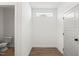 Hallway with access to a water closet with a window for natural light at 9173 Dupree Meadow Ct # 25, Angier, NC 27501