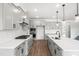 Beautiful kitchen with gray cabinets, large island, quartz counters, and stainless appliances at 9173 Dupree Meadow Ct # 25, Angier, NC 27501