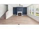 Living room featuring a fireplace, hardwood floors, and large windows at 9173 Dupree Meadow Ct # 25, Angier, NC 27501