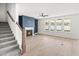 Bright living room with hardwood floors, fireplace, and natural light at 9173 Dupree Meadow Ct # 25, Angier, NC 27501