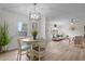Open floor plan dining room into the living room with a nice window view at 92 Papoose Trl, Lillington, NC 27546