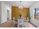 Dining room with unique wall accent, modern light fixture, and bright window at 92 Papoose Trl, Lillington, NC 27546