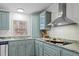 Well-lit kitchen with stainless steel appliances and granite countertops at 92 Papoose Trl, Lillington, NC 27546