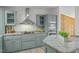 Well-lit kitchen with stainless steel appliances and granite countertops at 92 Papoose Trl, Lillington, NC 27546