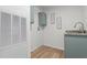 Functional laundry room with granite countertop, custom blue cabinetry, and modern design at 92 Papoose Trl, Lillington, NC 27546