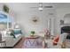Cozy living room with many plants and a decorative mirror at 92 Papoose Trl, Lillington, NC 27546