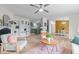 Open-concept living area with fireplace, shelving, and views of the kitchen and dining space at 92 Papoose Trl, Lillington, NC 27546