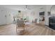 Bright living room with fireplace, ceiling fan, comfortable seating, and plenty of natural light at 92 Papoose Trl, Lillington, NC 27546