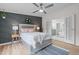 Beautiful main bedroom featuring a decorative accent wall and a doorway to the ensuite bathroom at 92 Papoose Trl, Lillington, NC 27546
