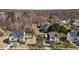 An aerial view of the property showing its location and proximity to neighboring houses and a treed area at 101 Cambridge Way, Oxford, NC 27565