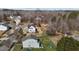 Aerial view of the home with a large backyard, mature trees and a partial view of the neighborhood at 101 Cambridge Way, Oxford, NC 27565