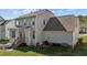 Backyard with a play area, a small patio, and manicured lawn at 101 Cambridge Way, Oxford, NC 27565