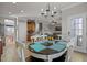 Bright dining area with a view into the kitchen and living room, promoting an open-concept feel at 101 Cambridge Way, Oxford, NC 27565