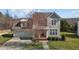 Inviting two-story home featuring a well-maintained lawn, two-car garage, and traditional design at 101 Cambridge Way, Oxford, NC 27565