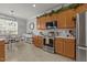 Bright kitchen with modern appliances, including stainless steel oven, microwave and plentiful counter space for cooking at 101 Cambridge Way, Oxford, NC 27565