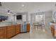 Spacious kitchen with stainless steel appliances, tiled flooring and lots of cabinets and counter space at 101 Cambridge Way, Oxford, NC 27565