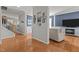 Inviting living room featuring hardwood floors, calming blue wall, and white trim and fireplace at 101 Cambridge Way, Oxford, NC 27565