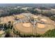Aerial view showcasing sports complex with baseball/softball fields, parking, and green spaces at 101 Cambridge Way, Oxford, NC 27565