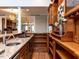 Wet bar featuring granite countertop, cabinets, wine storage, and hardwood floors at 101 Hedwig Ct, Cary, NC 27518
